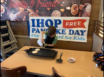 child making pancakes